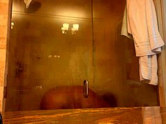 Mistress Danie enjoys a hot shower in PCB