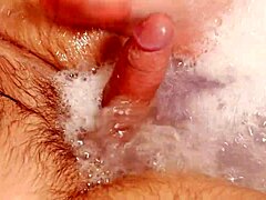 Busty MILF gives a footjob and assfucked in a hot tub