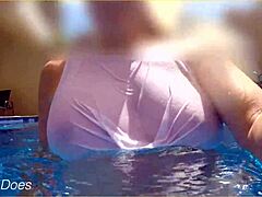 Hotel pool swim with a mature woman