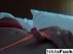 Mature blonde Nikita Von James flaunts her curves in fishnet lingerie