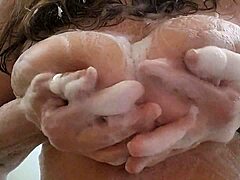 Mature mom invites you to join her soapy tit play