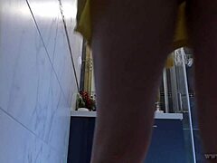 Petite wife with big tits bends over to change lingerie in the bathroom