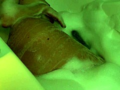 Sexy teen gets her pussy caressed in the bathtub by a man