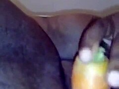 A mature Indian woman with a big ass and big tits pleasures herself with a carrot
