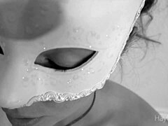 Masked mom gives a black and white POV blowjob