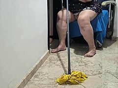 Hot mature woman gets naughty with a mop stick after swallowing hot piss